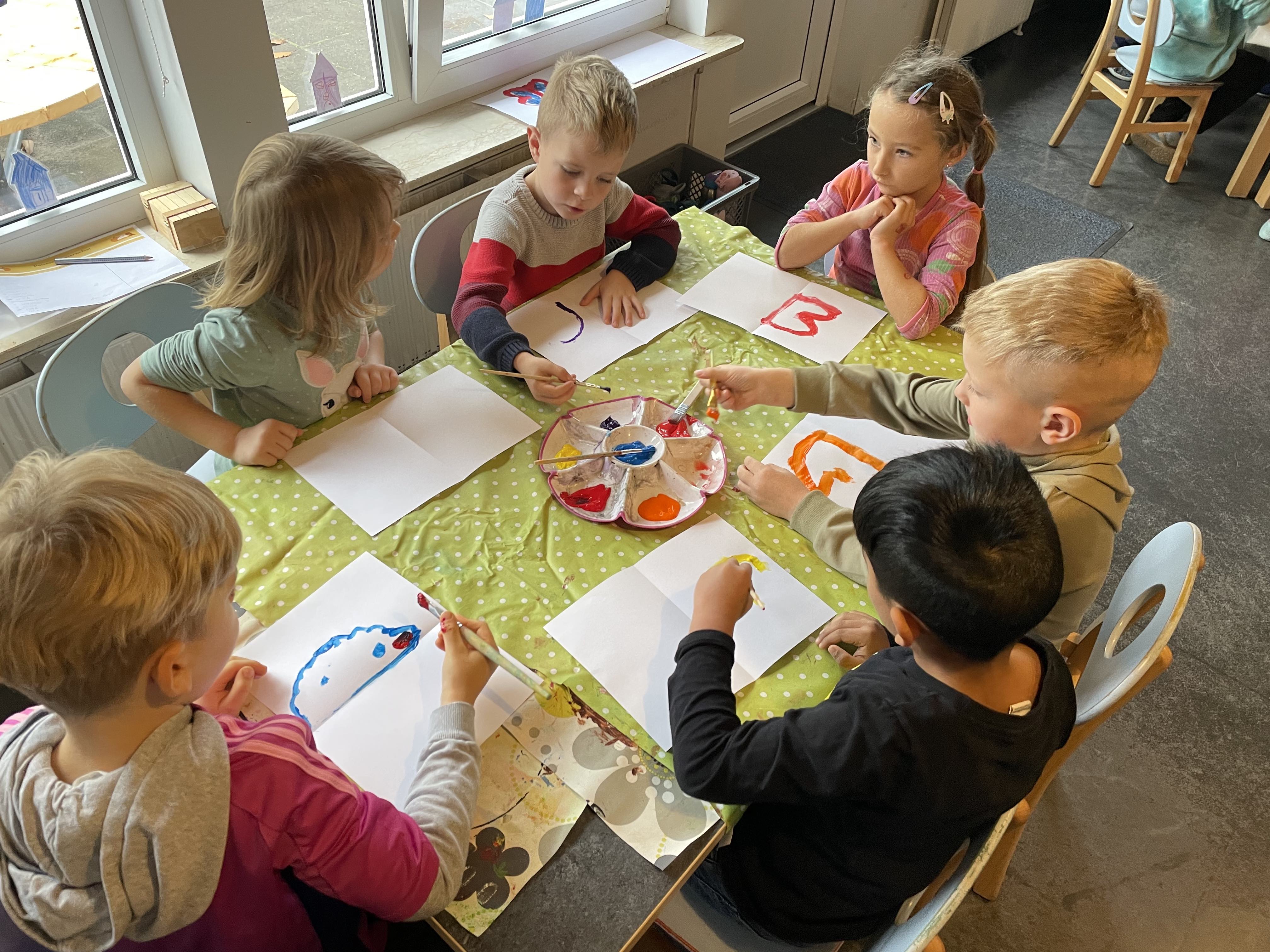 To sprog, ni dyr og en masse børn